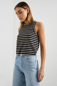 Sleeveless black and neutral stripe top with a round neck