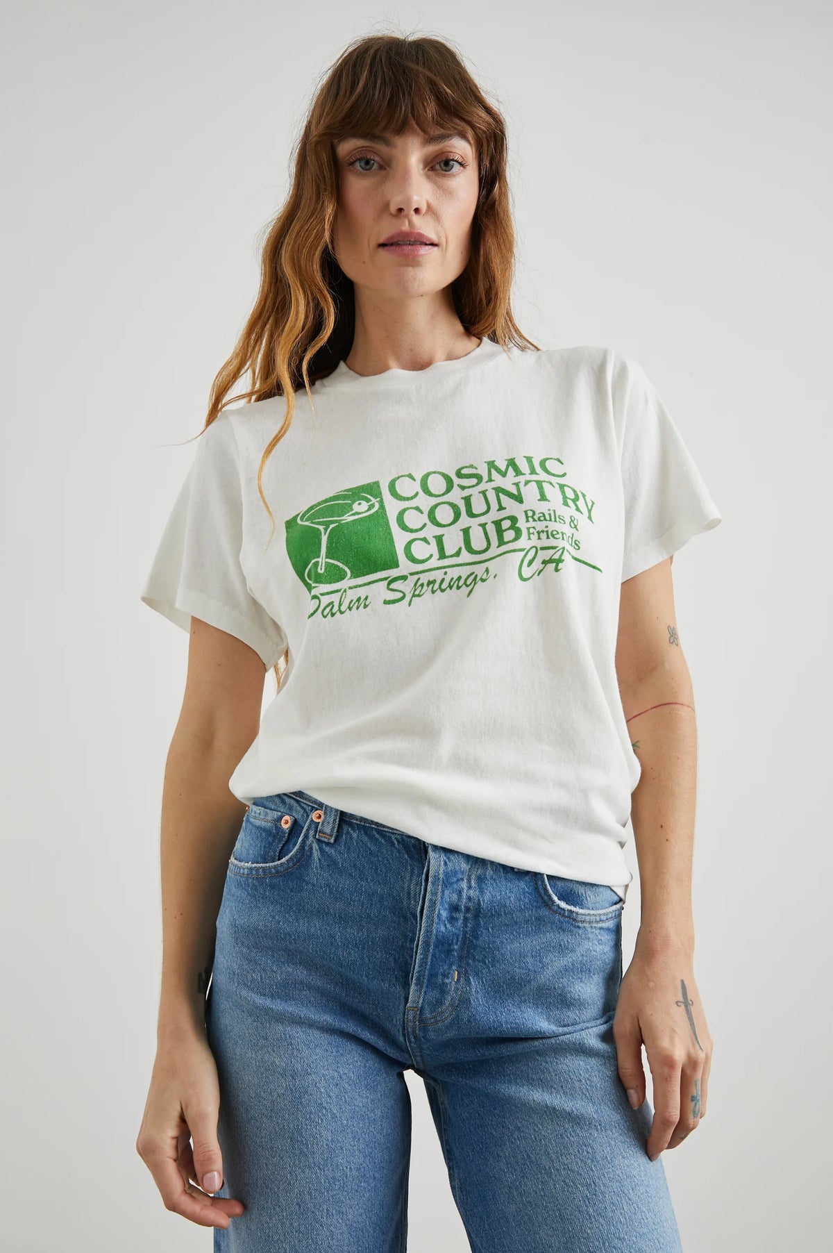 Ecru tee with cosmic country club logo on front