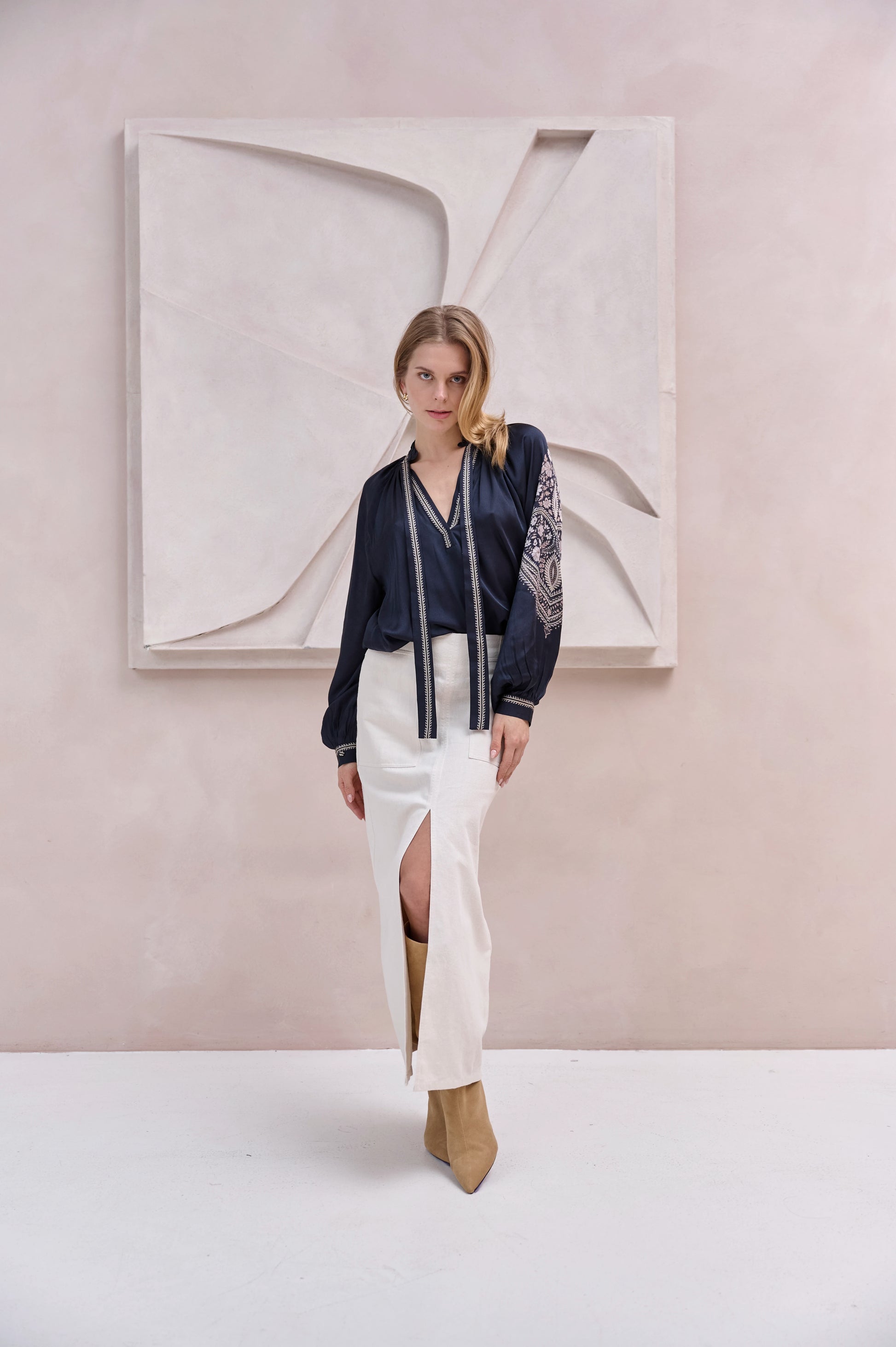 black silky blouse with paisley details and v neckline with a tie from brdr