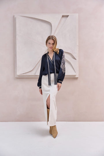 black silky blouse with paisley details and v neckline with a tie from brdr