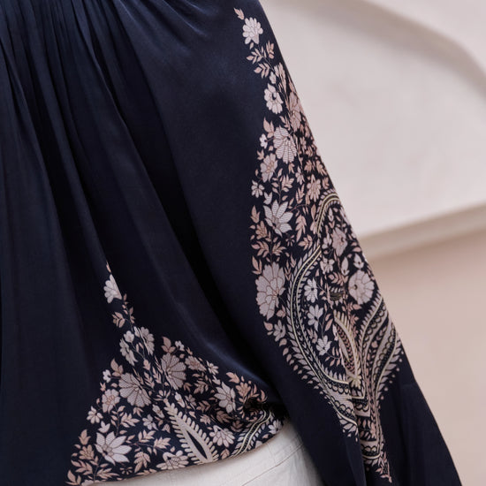 black silky blouse with paisley details and v neckline with a tie from brdr rear view