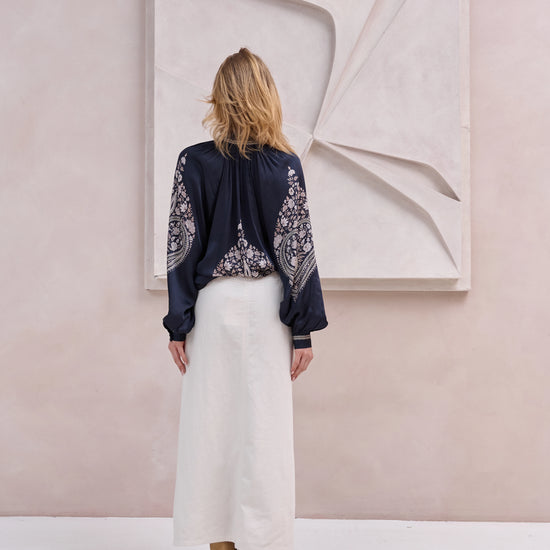 black silky blouse with paisley details and v neckline with a tie from brdr rear view