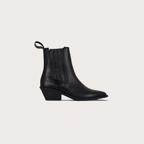 A single black mid-cut athletic boot shown in profile against a plain white background. The boot features a black synthetic upper with a hook-and-loop strap closure, a small white geometric logo on the ankle, and brand mark on the side.