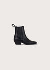 A single black mid-cut athletic boot shown in profile against a plain white background. The boot features a black synthetic upper with a hook-and-loop strap closure, a small white geometric logo on the ankle, and brand mark on the side.