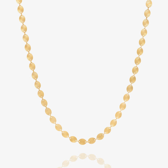 Gold chain necklace by Rachel Jackson on white background