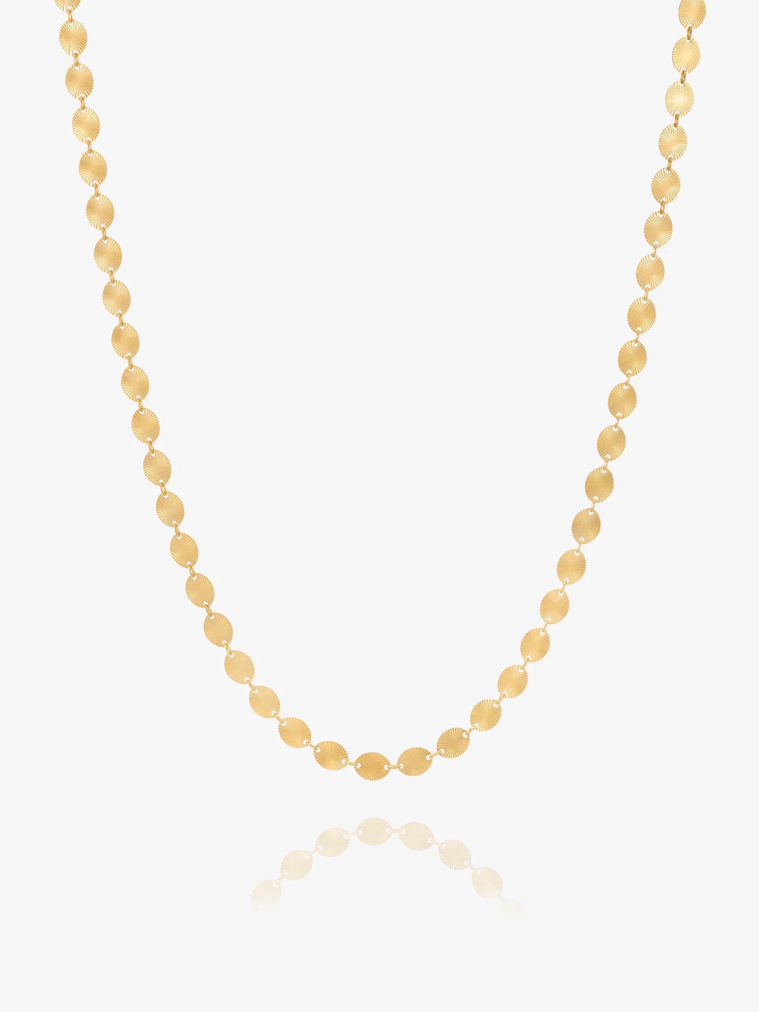 Gold chain necklace by Rachel Jackson on white background