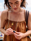 Woman wearing gold jewelry outdoors