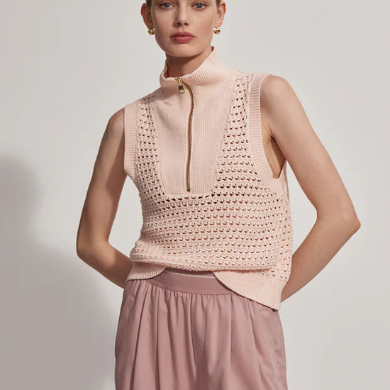 Sleeveless pointelle knit in pale pink with a half zip model shot