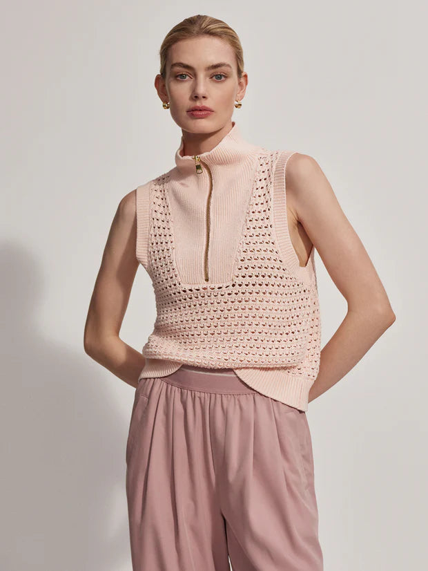 Sleeveless pointelle knit in pale pink with a half zip model shot