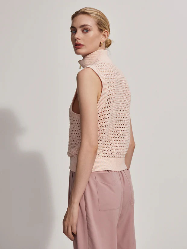 Sleeveless pointelle knit in pale pink with a half zip side view