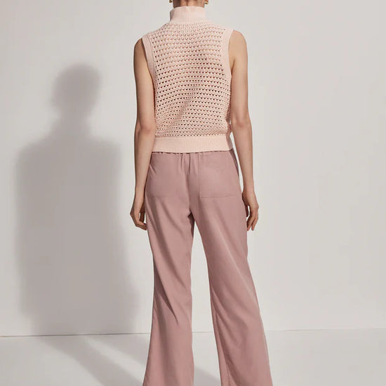 Sleeveless pointelle knit in pale pink with a half zip rear view