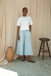 White tee worn with wide leg trousers