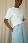 White tee worn with wide leg trousers