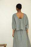 Rear view of gingham organic cotton top