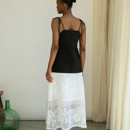 Woman wearing Beaumont organic white leace skirt rear view