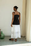 Woman wearing Beaumont organic white leace skirt rear view