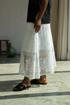 Person wearing a white lace skirt by Beaumont Organic close up