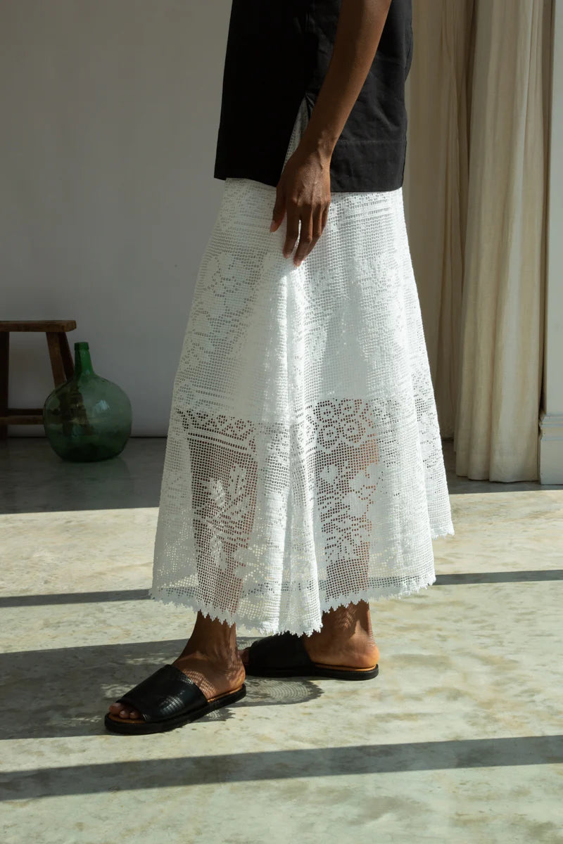 Person wearing a white lace skirt by Beaumont Organic close up