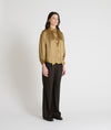 gold satin blouse with a tie bow at the neck and buttoned cuffs model shot