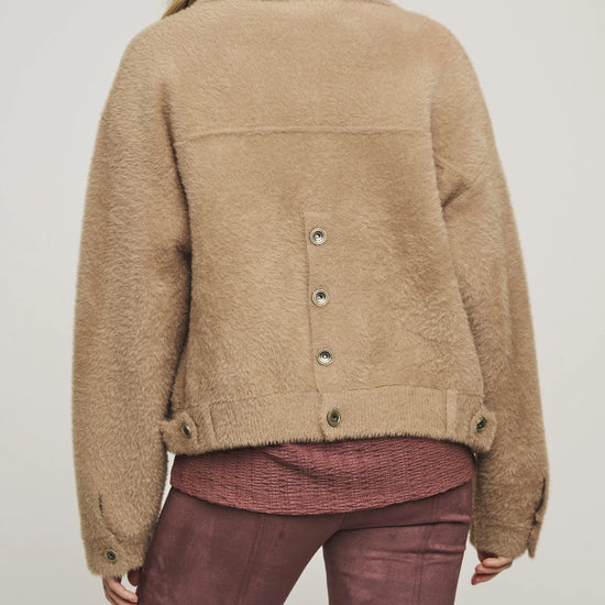 Rear view of button through jacket with button detail at the back