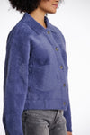 short fluffy blue jacket with collar, button down and 2 patch pockets side view 