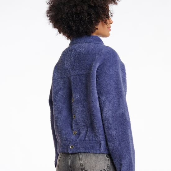 short fluffy blue jacket with collar, button down and 2 patch pockets rear view