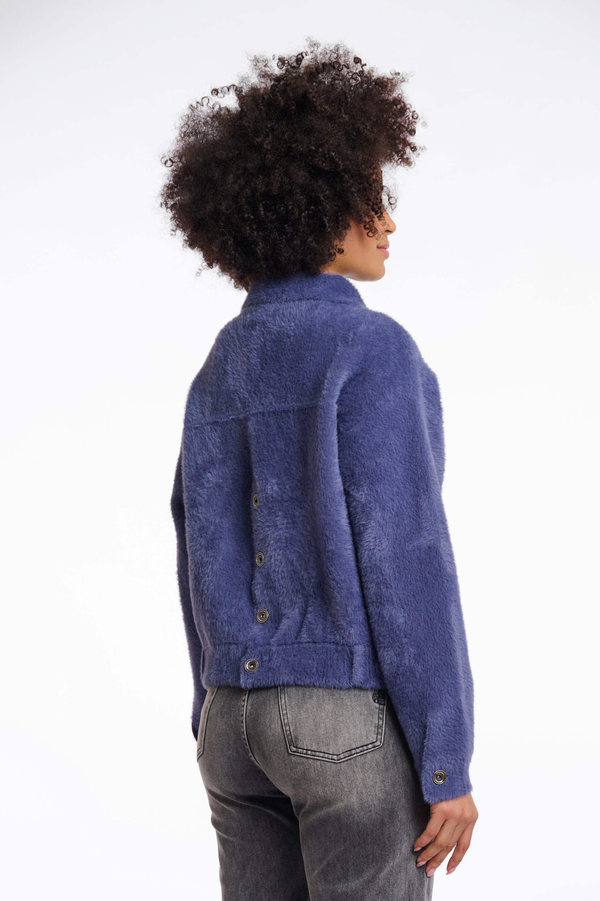 short fluffy blue jacket with collar, button down and 2 patch pockets rear view