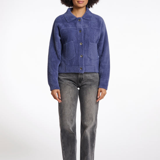 short fluffy blue jacket with collar, button down and 2 patch pockets model shot