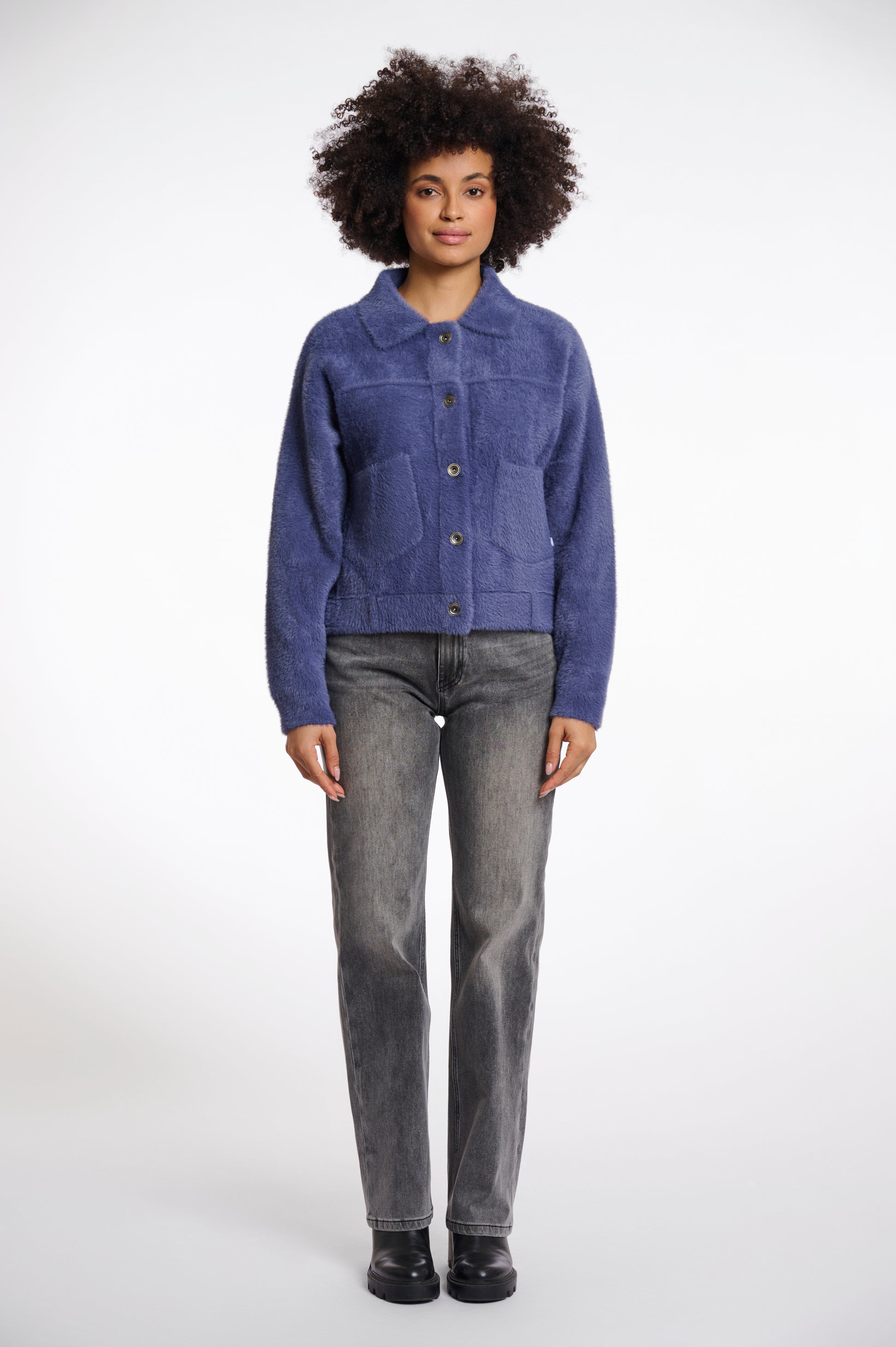 short fluffy blue jacket with collar, button down and 2 patch pockets model shot