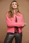 Boxy pink fluffy faux fur jacket with classic collar patch pockets and metallic button fastening