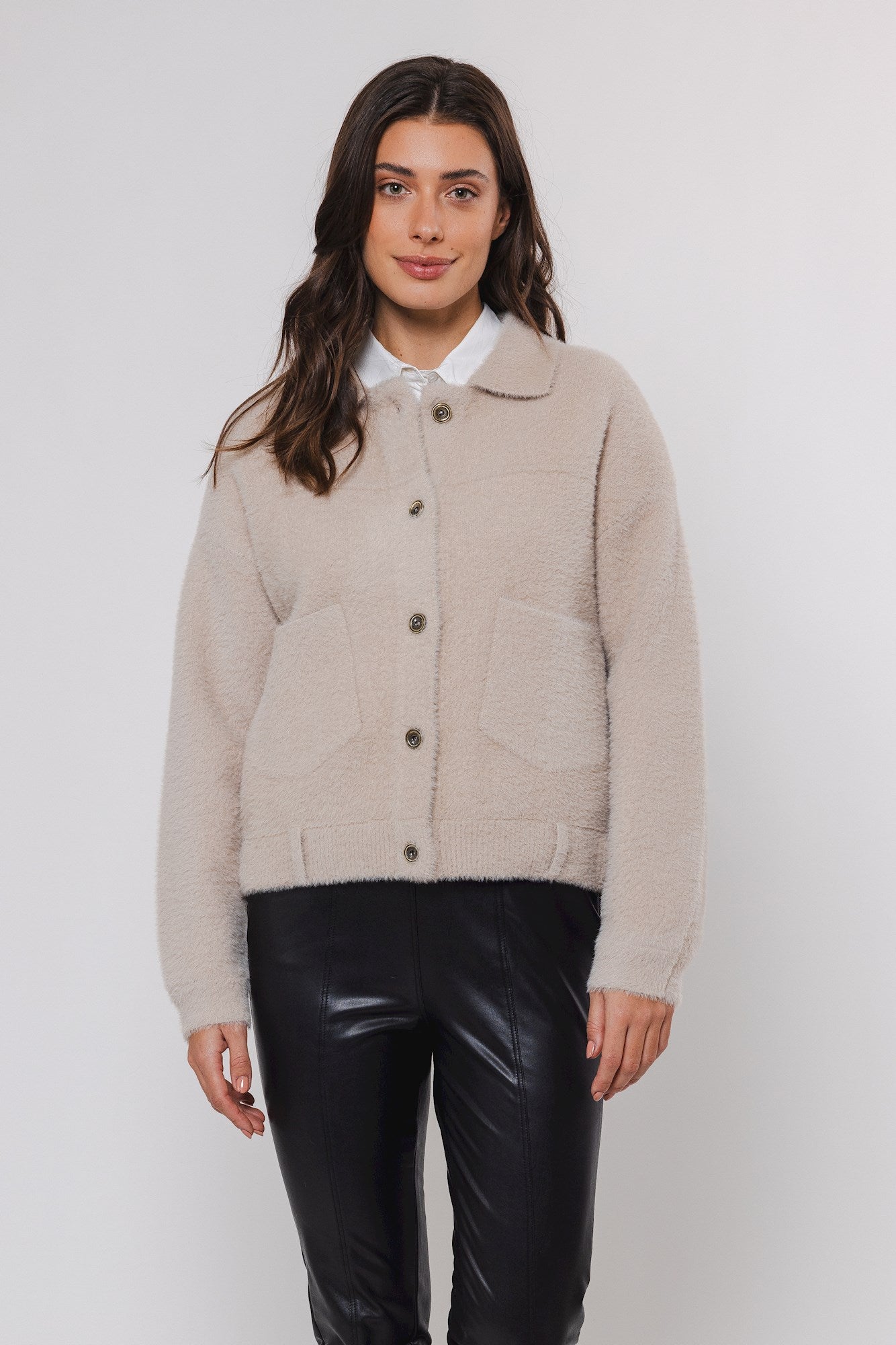 boxy beige soft cardigan with 2 front patch pockets and traditional collar