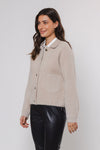 boxy beige soft cardigan with 2 front patch pockets and traditional collar side view 