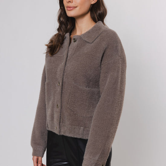 short taupe cardigan with classic collar and 2 front patch pockets  side view 