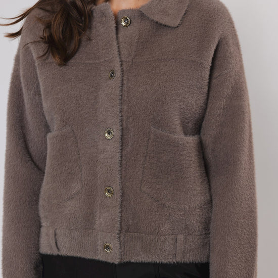 short taupe cardigan with classic collar and 2 front patch pockets  close up 