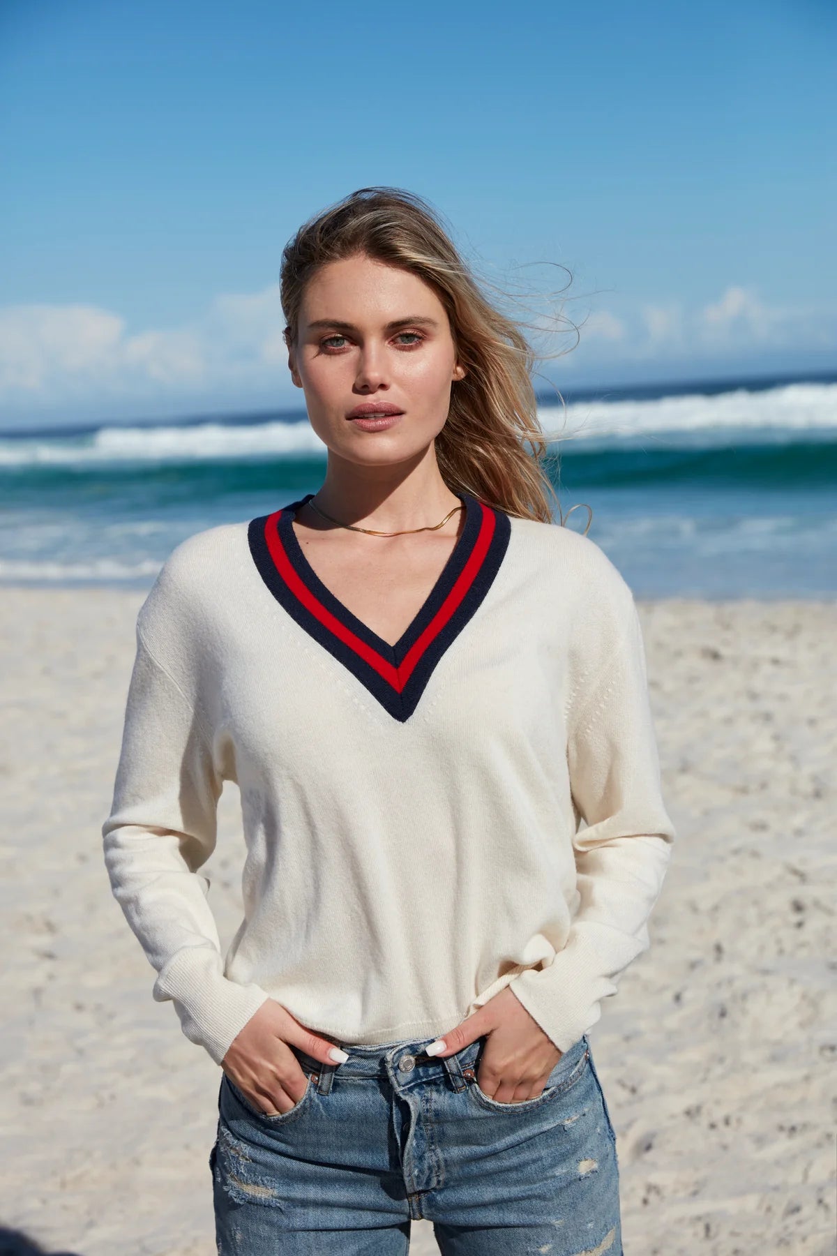 cream v-neck cricket inspired knit with red and navy trim