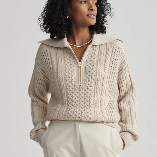 beige cable knit sweater with oversized collar and quarter zip model shot