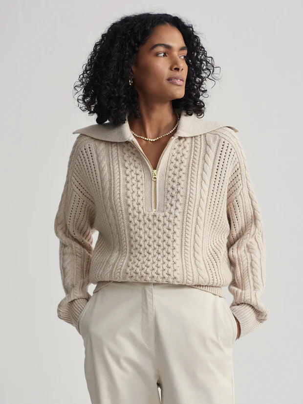 beige cable knit sweater with oversized collar and quarter zip model shot