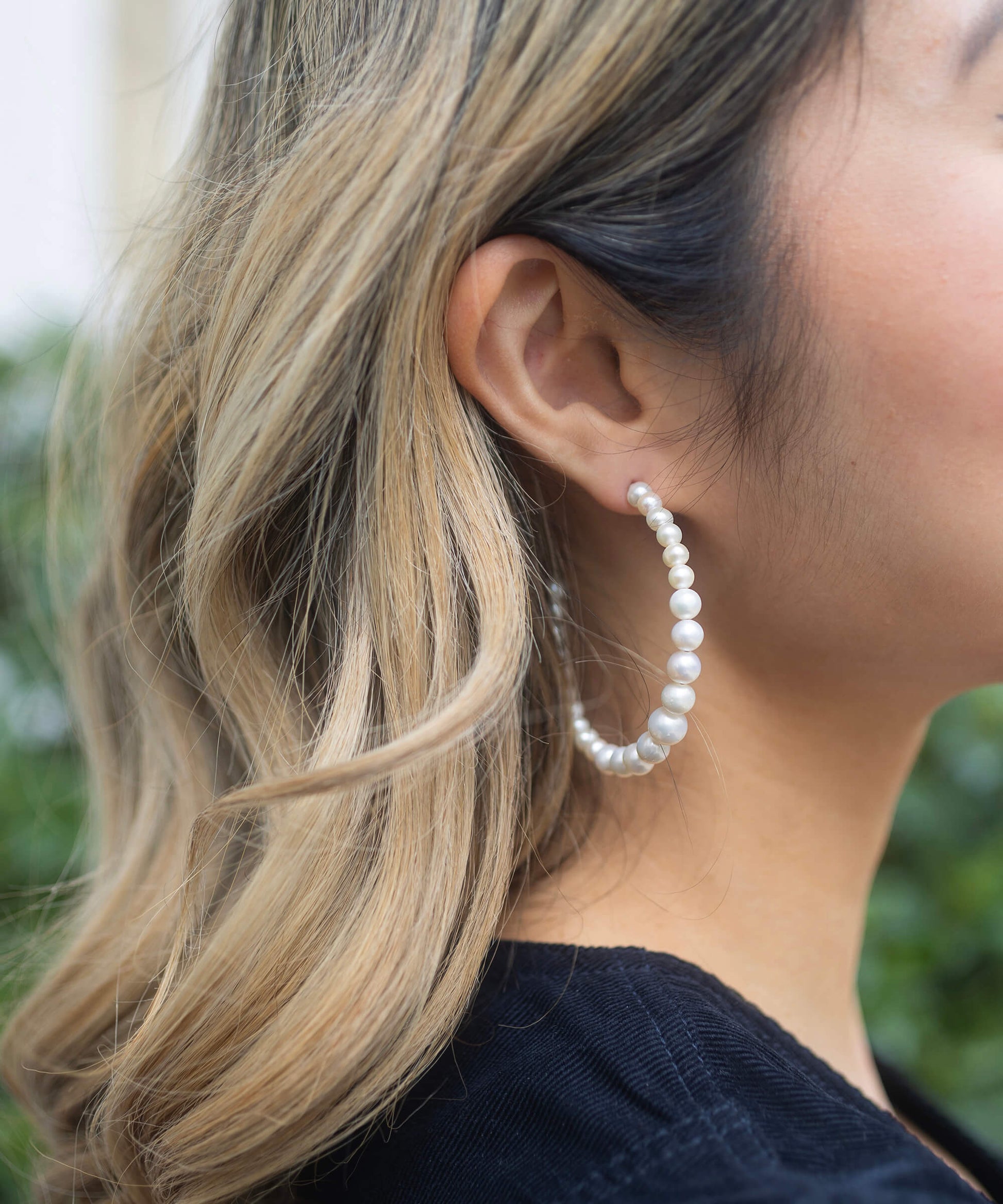 pearl hoops with gold fastening close up