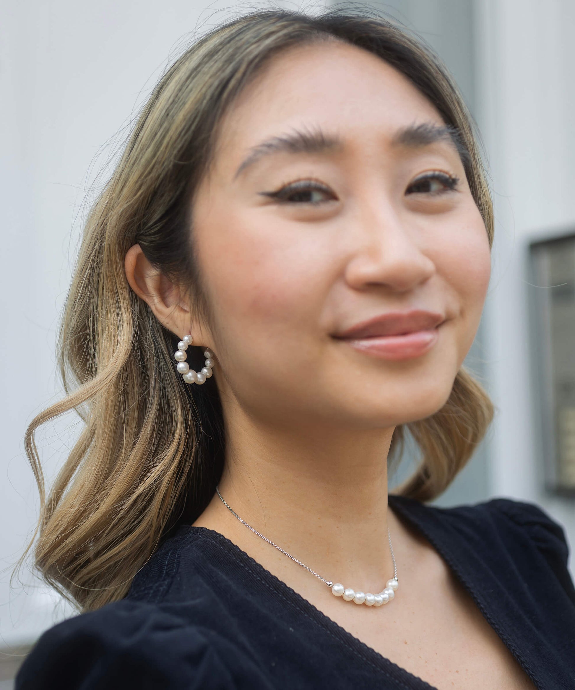 small pearl hoop earrings with silver back model shot