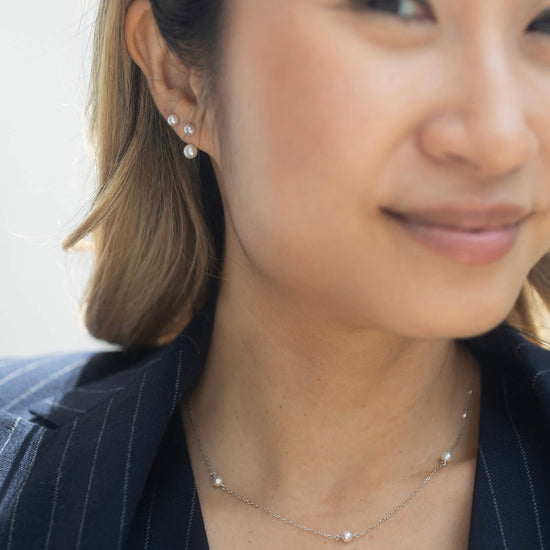 silver stud earrings with optional pearl drop model shot