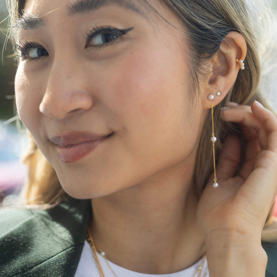 gold pearl stud earrings with 2 drop pearl chain model shot