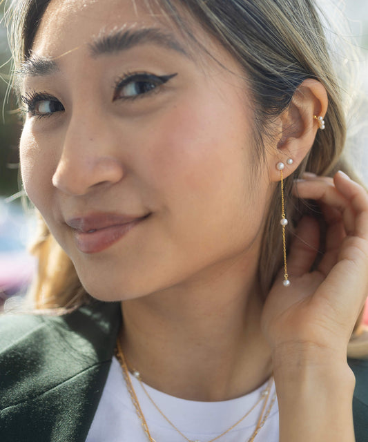 gold pearl stud earrings with 2 drop pearl chain model shot