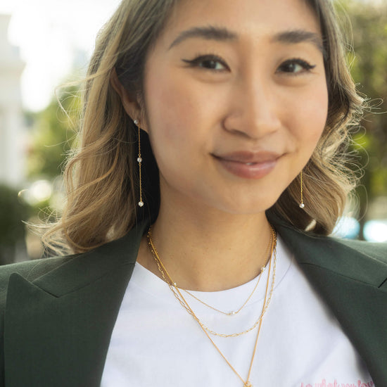 gold pearl stud earrings with 2 drop pearl chain model shot 