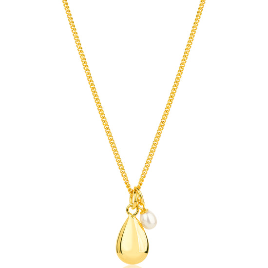 gold necklace with pendant and pearl