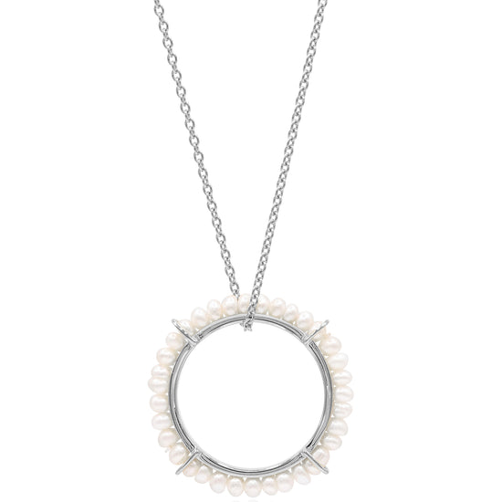 Silver necklace with a circular pendant featuring small pearls on a white background