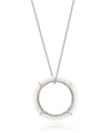 Silver necklace with a circular pendant featuring small pearls on a white background