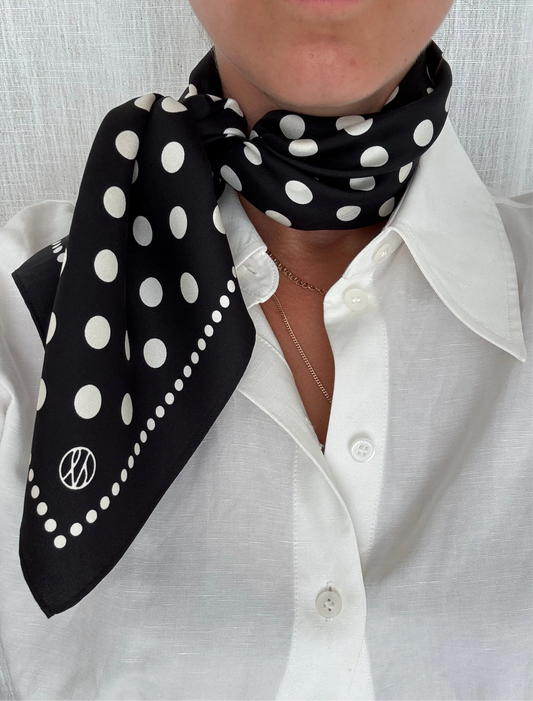 black silk square scarf with black background and white polka dots from lescarf model shot