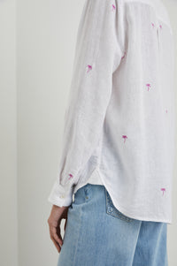Classic white linen blend shirt featuring an embroidered scattered palm tree design in hot pink
