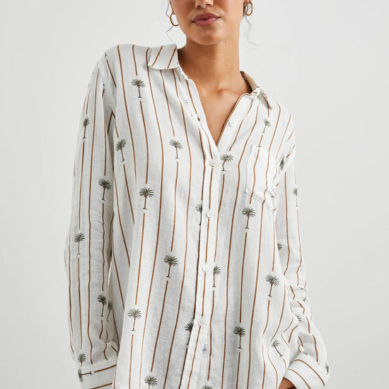 White linen blend shirt with classic collar and button through with brown vertical stripes and palm trees