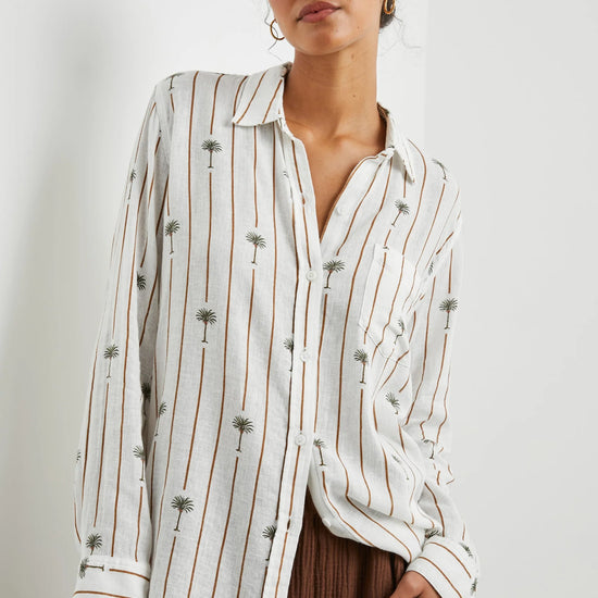 White linen blend shirt with classic collar and button through with brown vertical stripes and palm trees